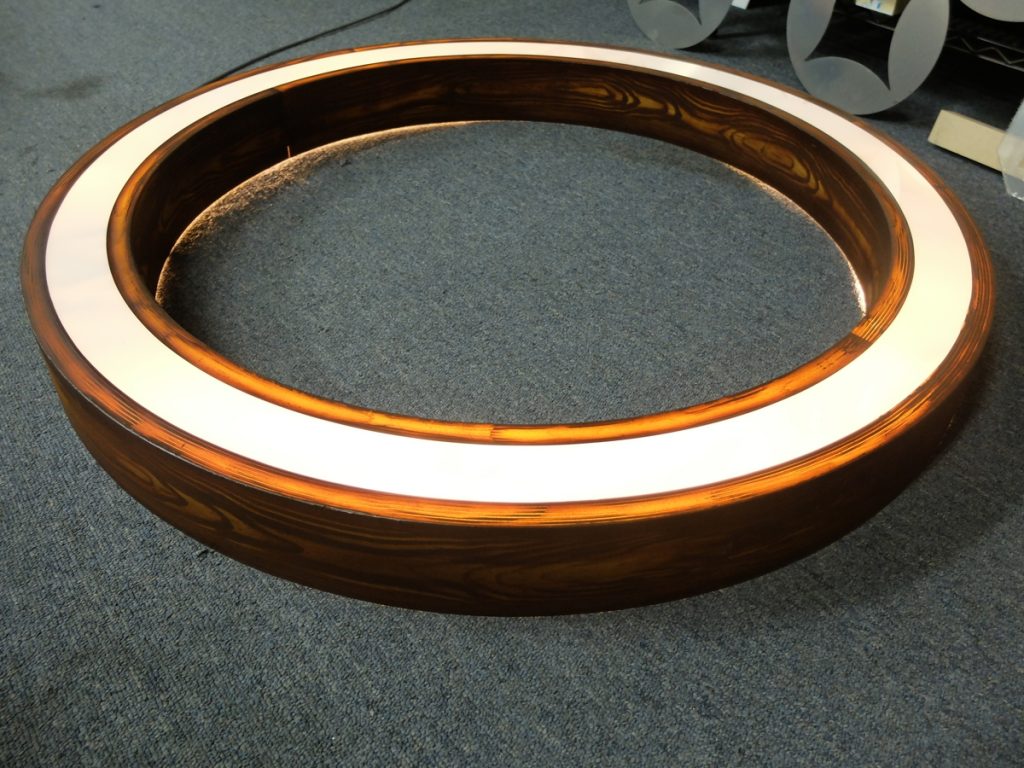 Circular LED faux wood finish light
